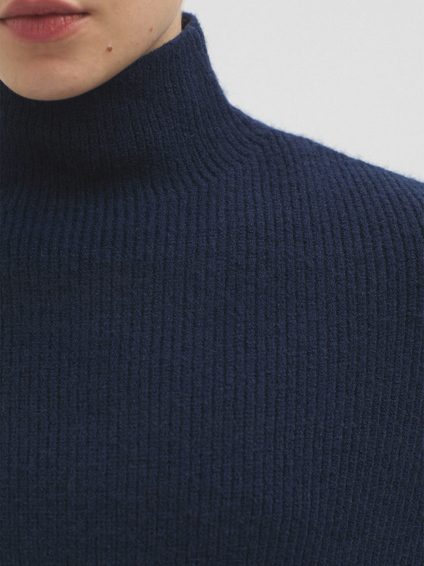Roll neck cape with splits
