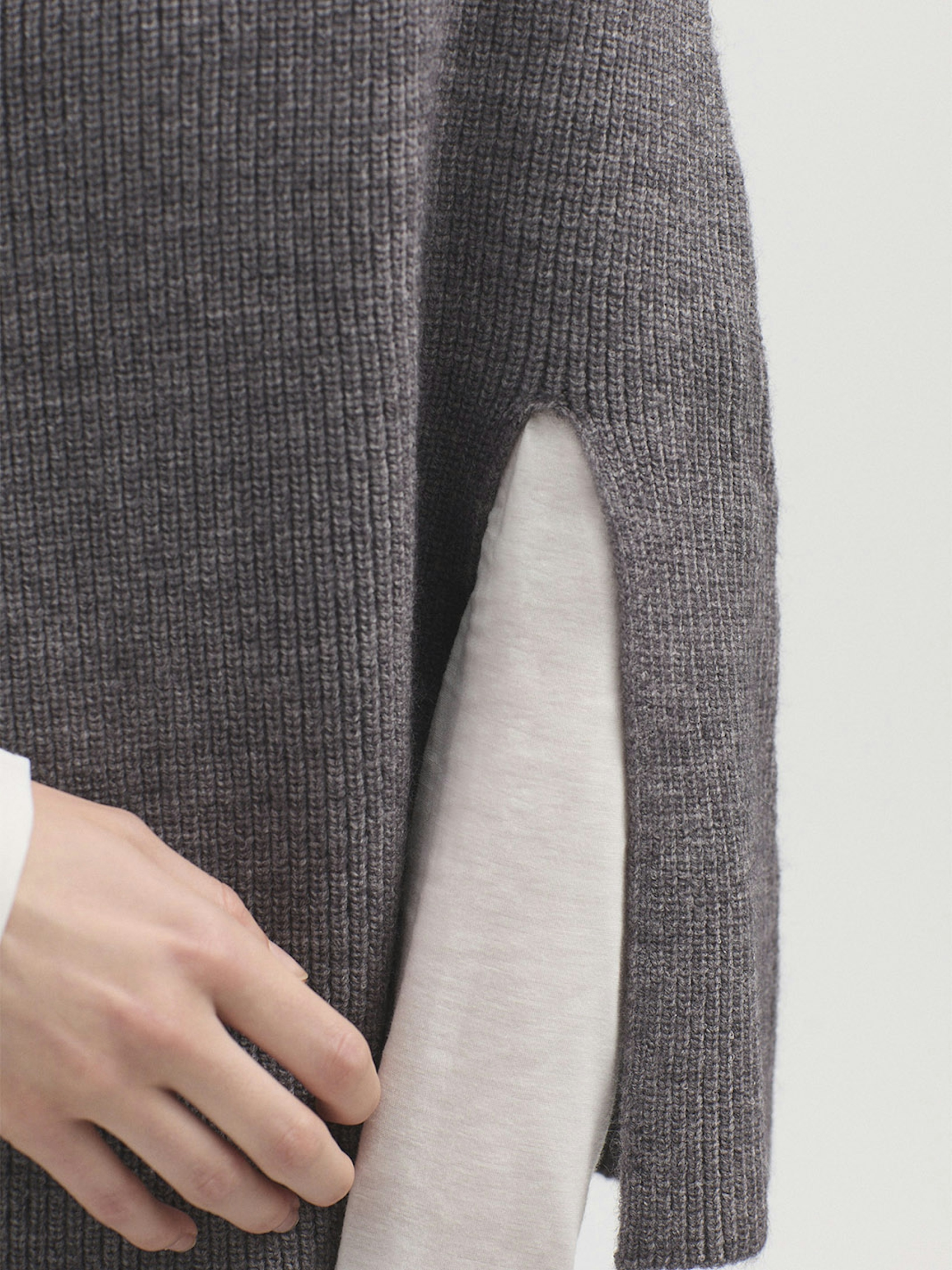 Roll neck cape with splits