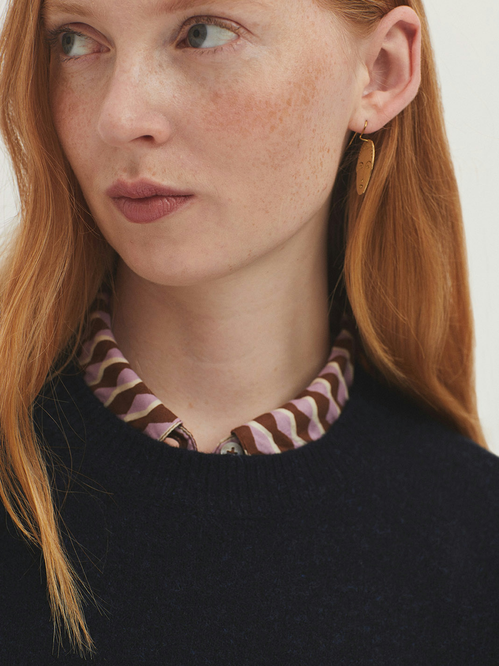 Lambswool jumper with checked sleeves