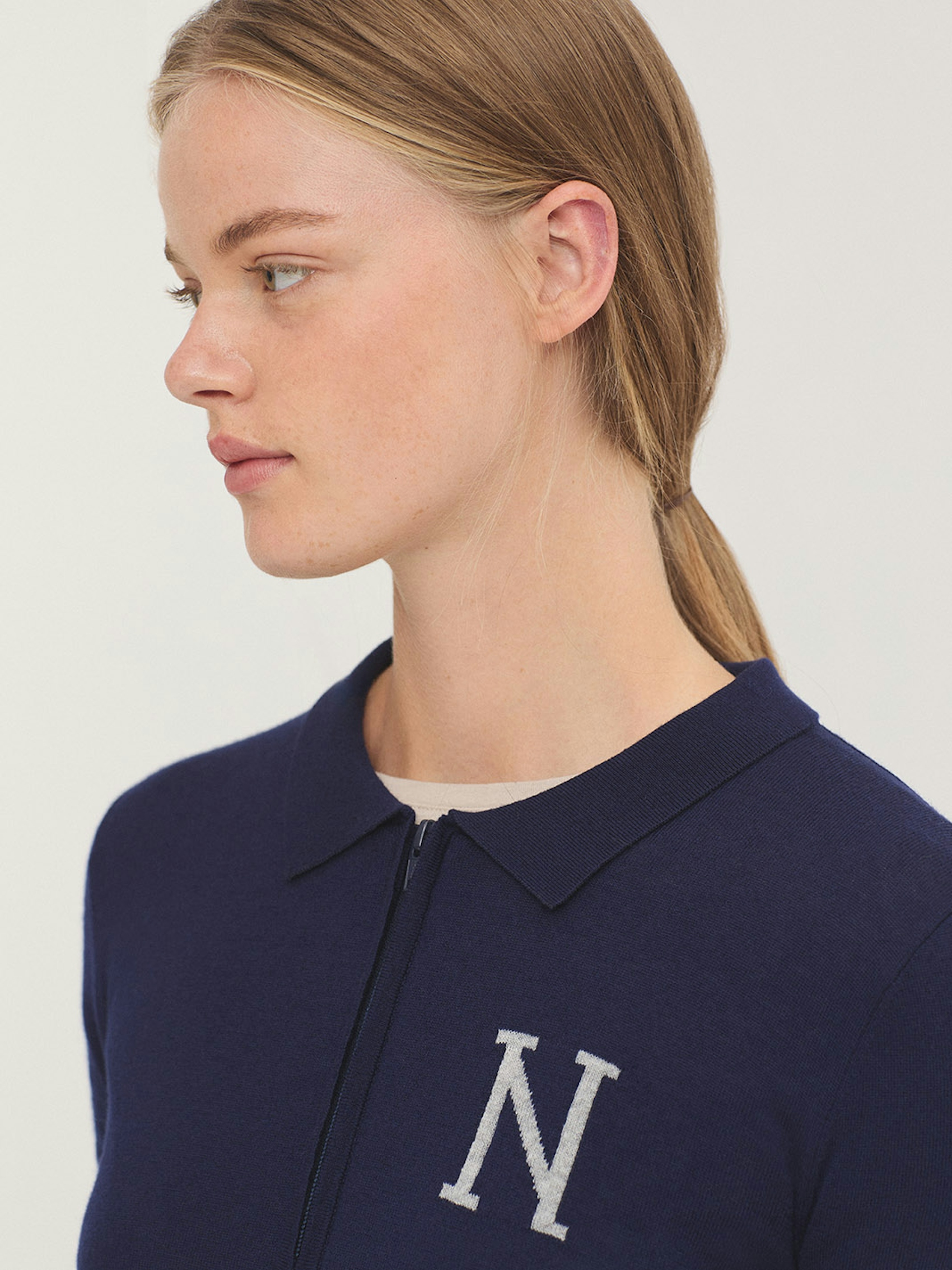Knit polo collar jumper with “N” intarsia knit
